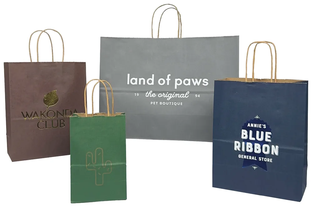 Solid tint kraft shopping bags in chocolate, evergreen, navy and slate gray, hot stamped with logos