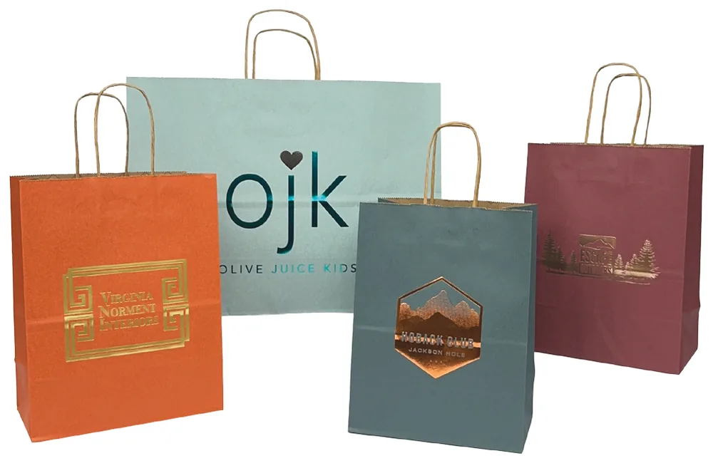 Mountain Vibes shopping bags in autumn, glacier mist, redwood and spruce green with a mountain design printed inside