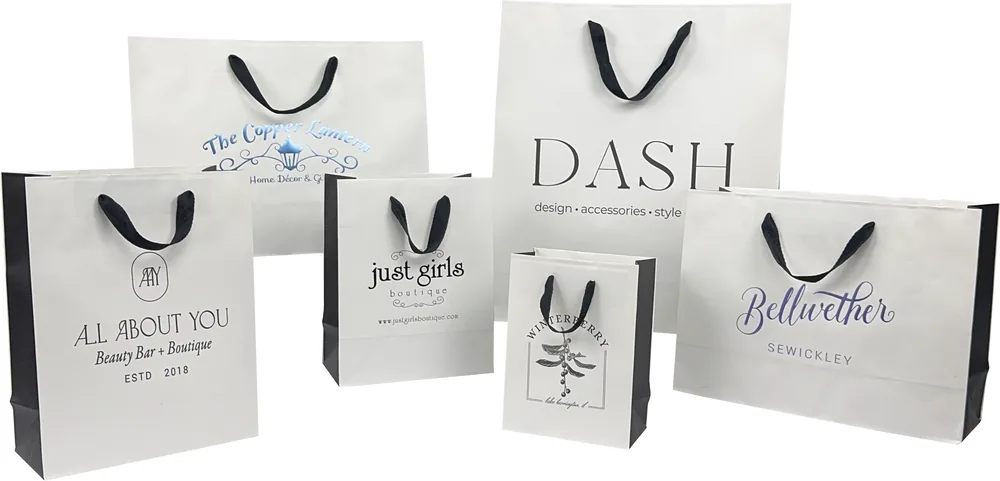 White Brooklyn totes with black gussets, black twill handles and printed logos