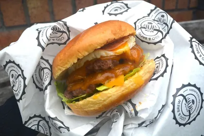 Burger on custom printed wax paper