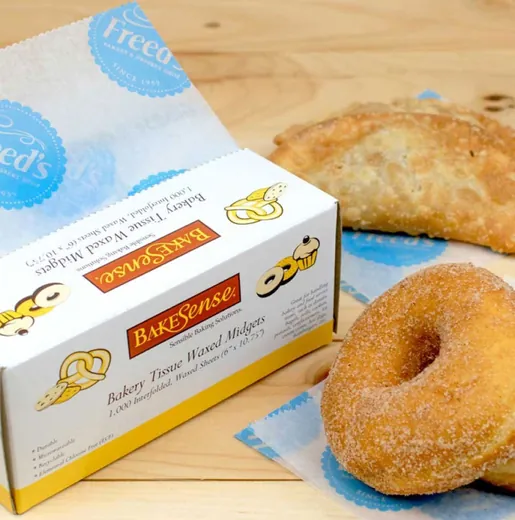 Bakery pastries on branded interleaving wax paper
