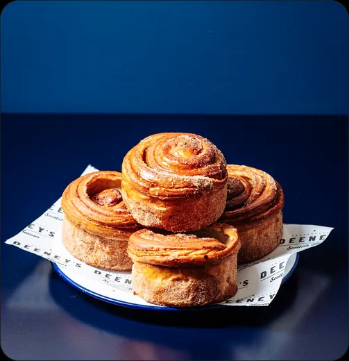 Cinnamon rolls on branded bakery paper