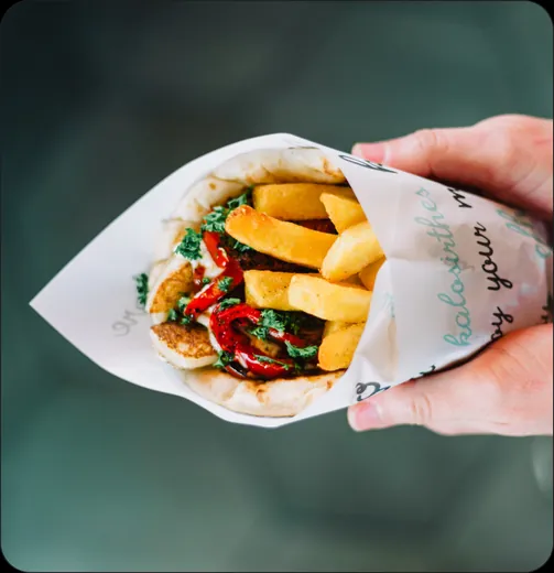 Loaded fries in a custom printed paper cone