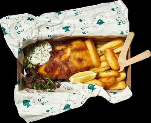 Fish and chips in a basket lined with printed grease-resistant paper