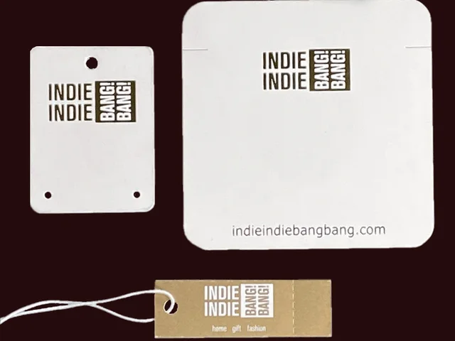 White and kraft jewelry cards with foil stamped logo and matching string tag